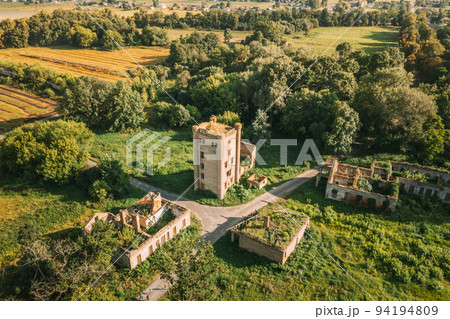 Aerial View Remains Of Yastrzhembsky Estate And Park Complex. Top View Of Old Five-storey Brick Water Tower. Drone View Of Beautiful European Nature From High Attitude In Summer Season. Bird's Eye Aerial View Remains Of Yastrzhembsky Estate And Park Complex. Top View Of Old Five-storey Brick Water Tower. Drone View Of Beautiful European Nature From High Attitude In Summer Season. Bird's Eye 94194809
