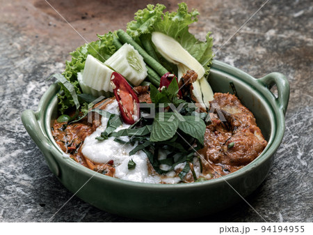 Traditional stir fried spicy Asian Redtail Catfish (Hemibagrus wyckioides) or Kang catfish with red curry paste. Traditional stir fried spicy Asian Redtail Catfish (Hemibagrus wyckioides) or Kang catfish with red curry paste. 94194955