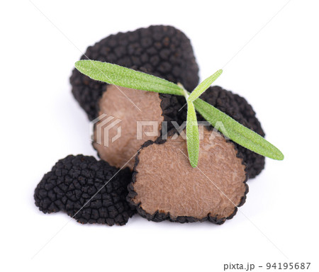 Black truffles isolated on a white background. Fresh sliced truffle. Delicacy exclusive truffle mushroom. Piquant and fragrant French delicacy. Clipping path. 94195687