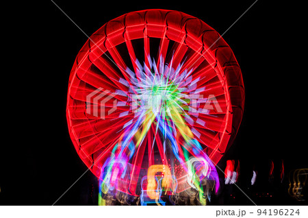 Blurred giant wheel, ferris at night Blurred giant wheel, ferris at night 94196224