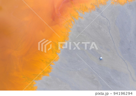 Aerial view of a toxic waste lake flooded a church Aerial view of a toxic waste lake flooded a church 94196294