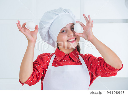 young baker child with eggs, easter 94198943