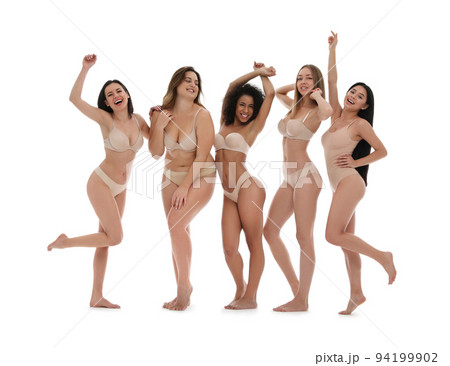 Group of women with different body types in jeans and underwear taking selfie against light Group of women with different body types in jeans and underwear taking selfie against light 94199902
