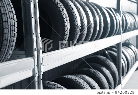 Tires on rack in car service workshop 94200529