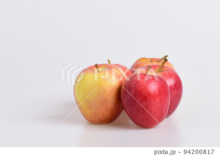 Apple fruits on light grey background. Apples in bright color 94200817