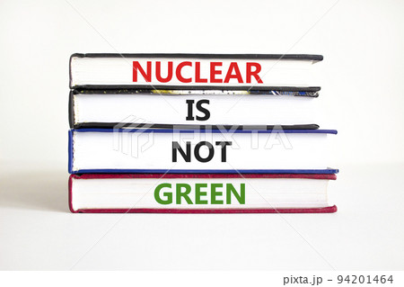 Nuclear is not green symbol. Concept words Nuclear is not green on books. Beautiful white table white background. Nuclear is not green business concept. Copy space. 94201464