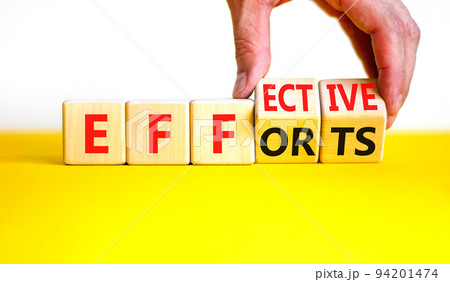 Effective efforts symbol. Concept words Effective efforts on wooden cubes. Businessman hand. Beautiful yellow table white background. Business effective efforts concept. Copy space. 94201474