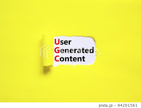 UGC user generated content symbol. Concept words UGC user generated content on white paper on a beautiful yellow background. Business and UGC user generated content concept. Copy space. 94201561