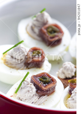 eggs filled with anchoa spread with anchoa on the top eggs filled with anchoa spread with anchoa on the top 94201847