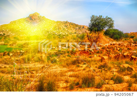 single mountain in India at sunset. single mountain in India at sunset. 94205067