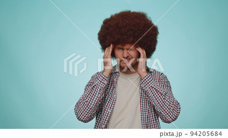 Man rubbing temples to cure headache problem, suffering from tension and migaine, stress, pain Man rubbing temples to cure headache problem, suffering from tension and migaine, stress, pain 94205684