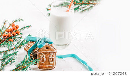 Milk and Christmas cookies for Santa. Christmas background. gingerbread cookies 94207248