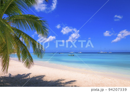 Tropical caribbean beach with sailboats and boat, Punta Cana, Dominican Republic 94207339