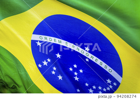 National flag of Brazil blowing on blue sky in Brasilia, South America National flag of Brazil blowing on blue sky in Brasilia, South America 94208274