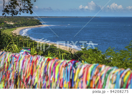 Beach and Lord of Bonfim ribbon tapes symbol of good luck in Trancoso, BAHIA 94208275