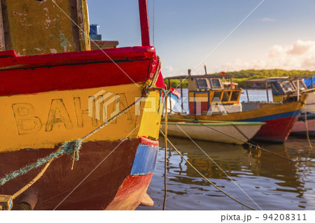 Bay at sunset with fishing trawler rustic boats in Porto Seguro, BAHIA, Brazil Bay at sunset with fishing trawler rustic boats in Porto Seguro, BAHIA, Brazil 94208311
