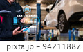 Asian man fix Technology AI fix car repair on car Lift in garage dealership Fix the car with a touch touching UI screen interface point to the point  corrected New technology in IOT car industry 94211887