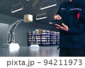 Asian Man Engineer hold smartphone touch touching UI screen interface for manufacturing industry technology Product export and import future Robot cyber warehouse arm robot future technology 94211973