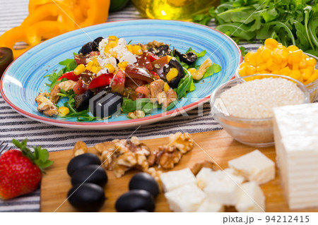 Ingredients for salad from arugula and vegetables 94212415