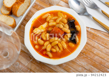 Tasty homemade stew of asturian beans with sausages. Spanish cuisine 94212423
