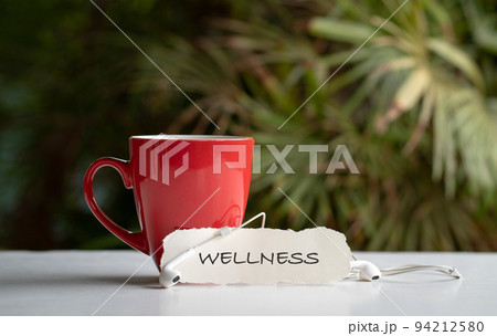 Wellness sign next to red cup. Wellness sign next to red cup. 94212580