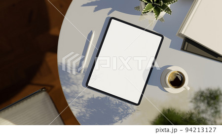 Digital tablet white screen mockup on modern white table. top view, workspace. 94213127