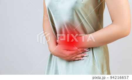 Menstrual pain, woman with stomachache suffering from pms , endometriosis, cystitis and other diseases of the urinary system, painful area highlighted in red Menstrual pain, woman with stomachache suffering from pms , endometriosis, cystitis and other diseases of the urinary system, painful area highlighted in red 94216657