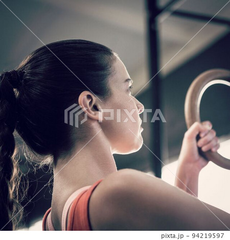 Young woman exercising in gym 94219597
