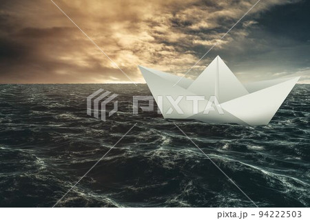 Paper boat floating on the sea 94222503