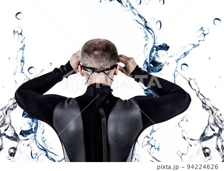 Rear view of swimmer amidst splashing water 94224626