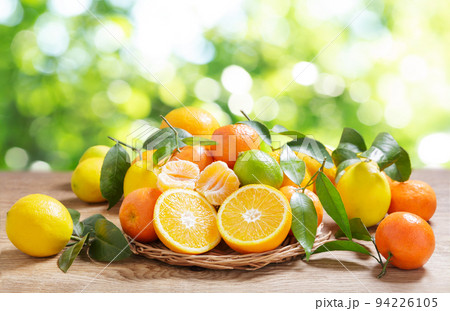 fresh citrus fruits on a wooden table 94226105