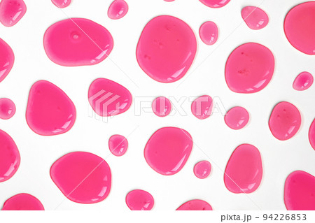 Pink doses of acid, hyaluronic moisturizing serum or gel isolated on white background. Abstract backdrop pattern. Beauty product wallpaper. Cosmetics or healthcare protection concept.  94226853