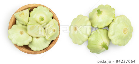 green pattypan squash in wooden bowl isolated on white background. Top view green pattypan squash in wooden bowl isolated on white background. Top view 94227064
