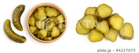 Marinated pickled cucumber in wooden bowl isolated on white background with full depth of field. Top view. Flat lay Marinated pickled cucumber in wooden bowl isolated on white background with full depth of field. Top view. Flat lay 94227075