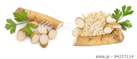 Horseradish root with slices and parsley isolated on white background. Top view. Flat lay 94227114