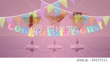 Image of congratulation text and bunting over three cocktail glasses on pink background 94227211