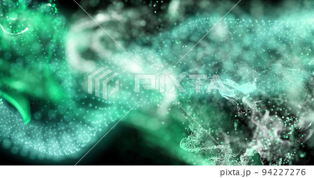 Image of green and white particles moving on black background Image of green and white particles moving on black background 94227276