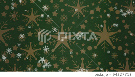 Image of christmas stars falling over snowflakes on green background 94227713