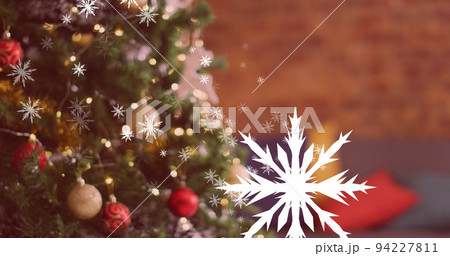 Image of christmas snowflakes falling over christmas tree 94227811