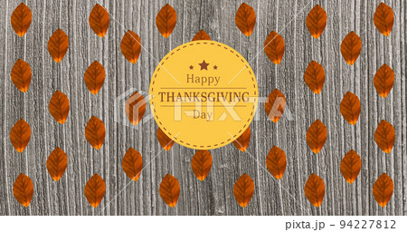 Image of happy thanksgiving day text over wooden background with autumn leaves 94227812