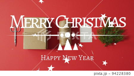 Image of merry christmas greetings text over christmas decorations 94228380