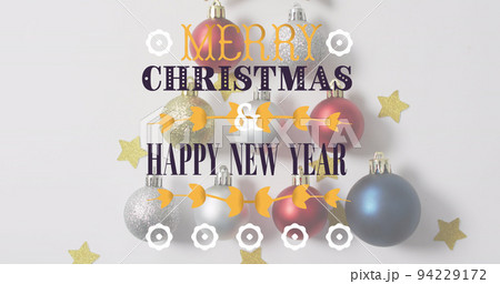 Image of merry christmas text over christmas decorations 94229172