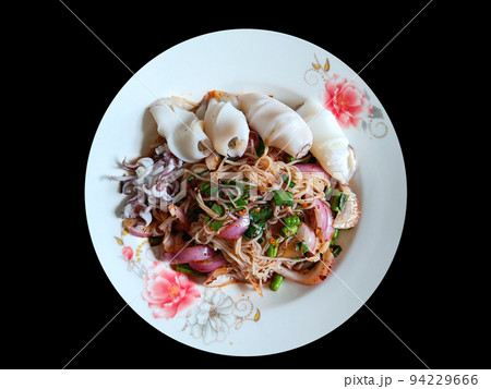 Rice Vermicelli Noodles squid Spicy Salad on black background with clipping path Rice Vermicelli Noodles squid Spicy Salad on black background with clipping path 94229666