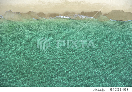 Overhead view of turquoise ocean and beach Overhead view of turquoise ocean and beach 94231493