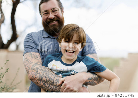 Father hugging son (8-9) Father hugging son (8-9) 94231748