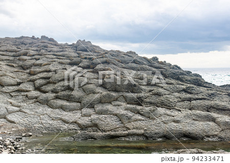 strange coastal landscape of weathered basalt rocks 94233471