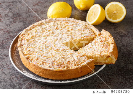 Cake with Streusel, lemon and crunch close-up in a plate. Horizontal Cake with Streusel, lemon and crunch close-up in a plate. Horizontal 94233780