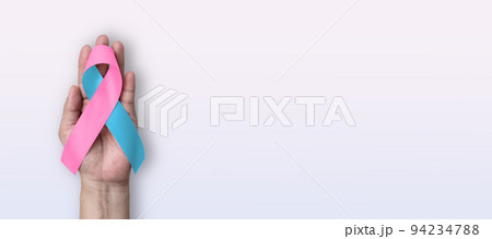 Pink light blue ribbon awareness for Birth defects month, (SIDS) Infertility, Pregnancy Miscarriage, Infant Loss, Amniotic Fluid Embolism, Male breast cancer, bow on white background on hand 94234788