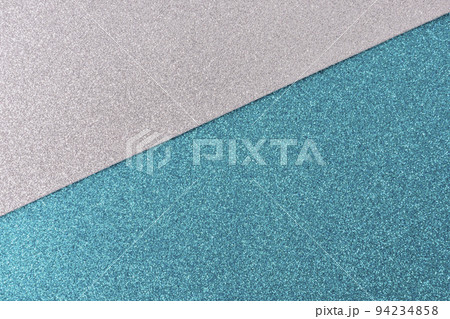 Shiny and glittering surface. Silver and blue, turquoise, abstract background. Events, celebrations. Trendy backdrop for your design. Texture with glitter. 94234858