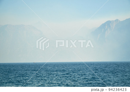 Morning mist, mountains and sea 94236423
